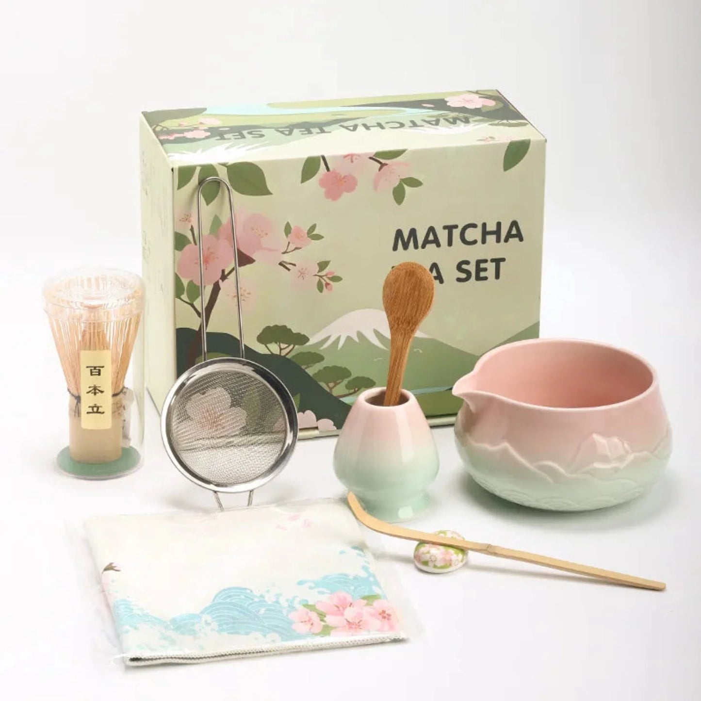 Matcha tea set with a decorative box featuring floral designs on a white background