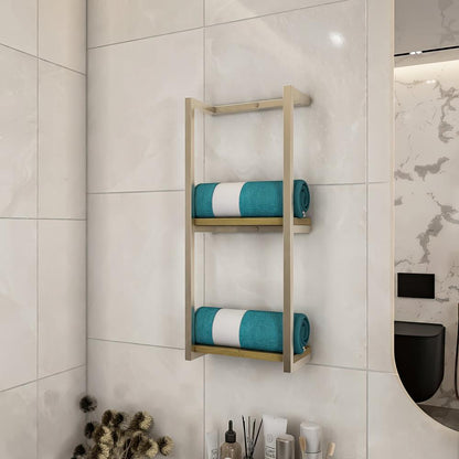 Wall-mounted bathroom shelf with a light wood base, holding neatly folded blue towels, mounted on a dark stone-tiled wall, creating a modern aesthetic