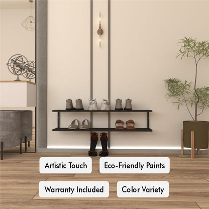 2 Tier Metal Shoe Storage shown wall-mounted in a minimalist beige room, holding multiple pairs of shoes with boots arranged on the floor below.