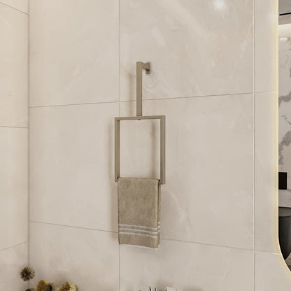 Wall-mounted Satine Nickel vertical towel rack holding a beige towel, displayed in a modern bathroom with light-colored tiles and minimalistic decor.